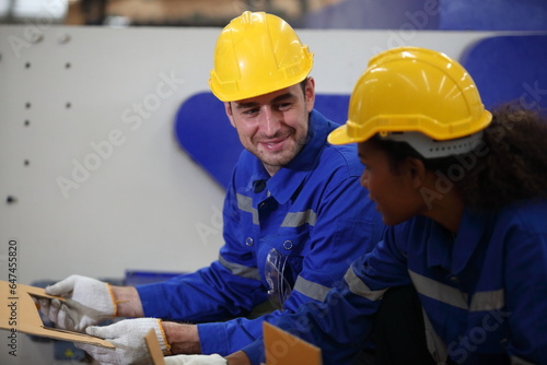 worker or engineer working in factory with safety uniform , safety hat and safety glasses , image is safety concept or happy workplace