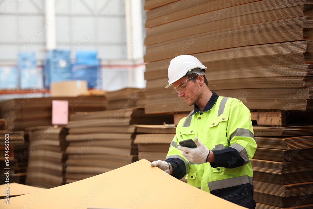 worker or engineer working in factory with safety uniform , safety hat and safety glasses , image is safety concept or happy workplace worker or engineer working in factory with safety uniform , safety hat and safety glasses , image is safety concept or happy workplace