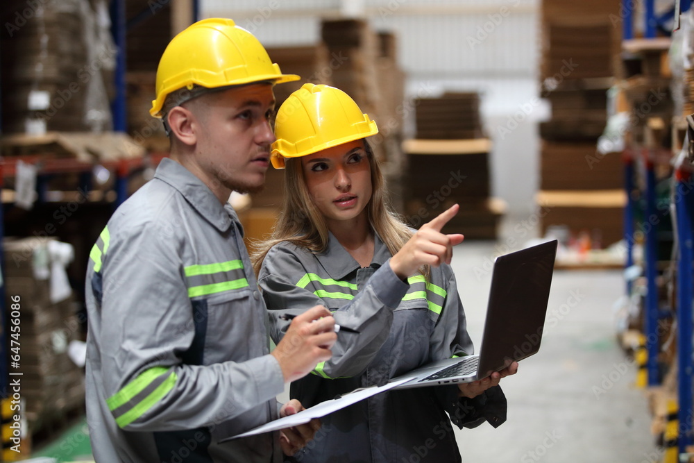 worker or engineer working in factory with safety uniform , safety hat and safety glasses , image is safety concept or happy workplace worker or engineer working in factory with safety uniform , safety hat and safety glasses , image is safety concept or happy workplace