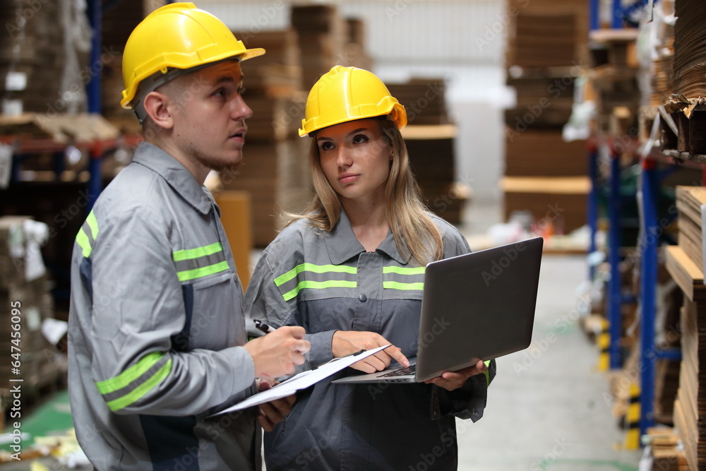 worker or engineer working in factory with safety uniform , safety hat and safety glasses , image is safety concept or happy workplace worker or engineer working in factory with safety uniform , safety hat and safety glasses , image is safety concept or happy workplace