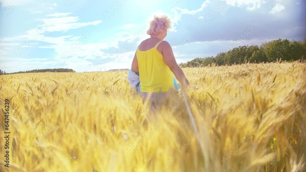 Summer's Bounty: Woman Strolling Through Sunlit Wheat Field, Celebrating Abundant Harvest Summer's Bounty: Woman Strolling Through Sunlit Wheat Field, Celebrating Abundant Harvest