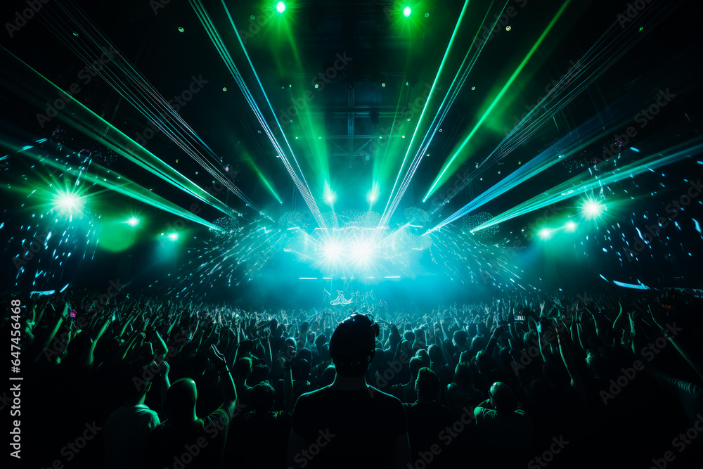 Crowd of people at live DJ event. Venue or festival, with bright green neon lasers above the crowd. Electronic music concept - obrazy, fototapety, plakaty 