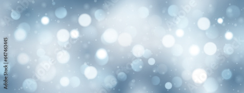 Abstract background with bokeh effect in light blue colors