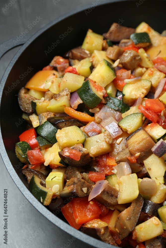Delicious ratatouille in baking dish on grey table, closeup Delicious ratatouille in baking dish on grey table, closeup
