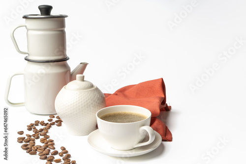 Set of a ceramic coffee cup with coffe maker
