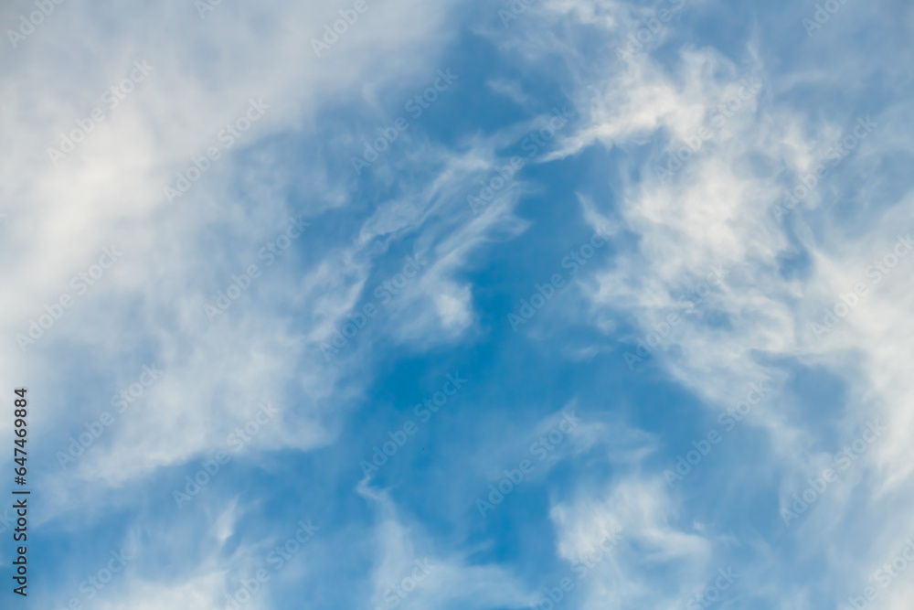 Blue sky with white soft wispy high clouds Blue sky with white soft wispy high clouds