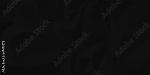 Black silk crumpled paper texture dark black crumpled paper texture crush paper so that it becomes creased and wrinkled. Old black crumpled paper sheet background texture.