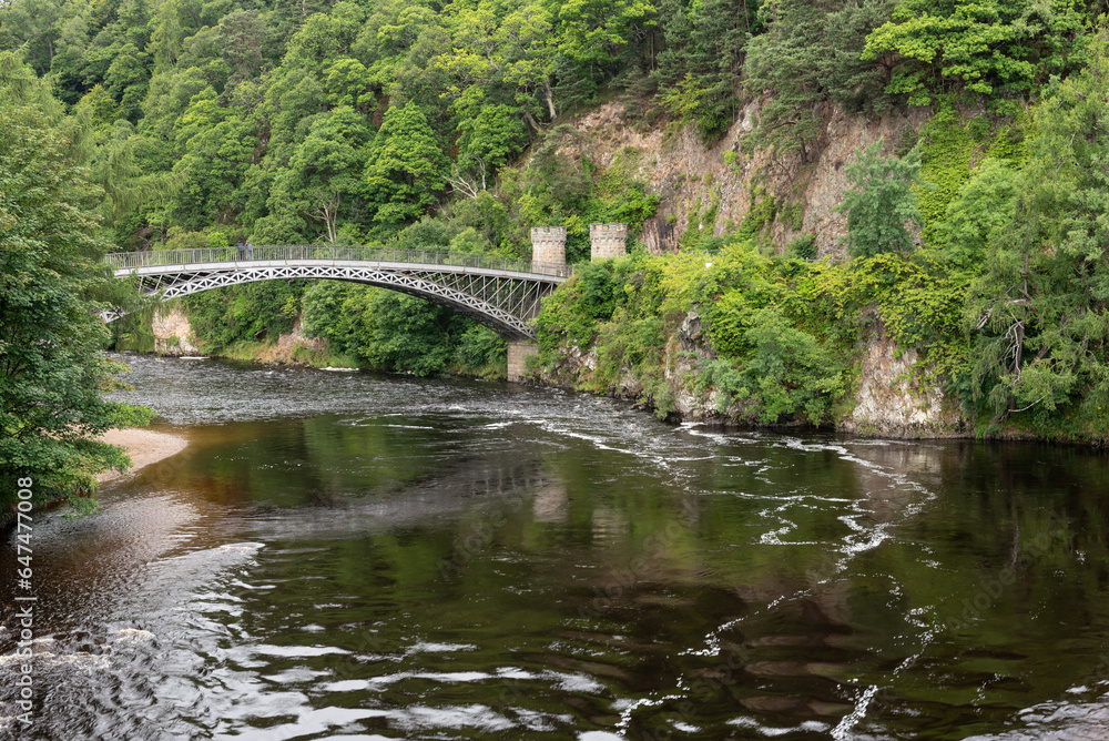 Craigellachie Bridge over the River Spey, Moray, Scotland,United Kingdom. Made of cast iron, designed by Thomas Telford and built between 1812 and 1814. - obrazy, fototapety, plakaty 