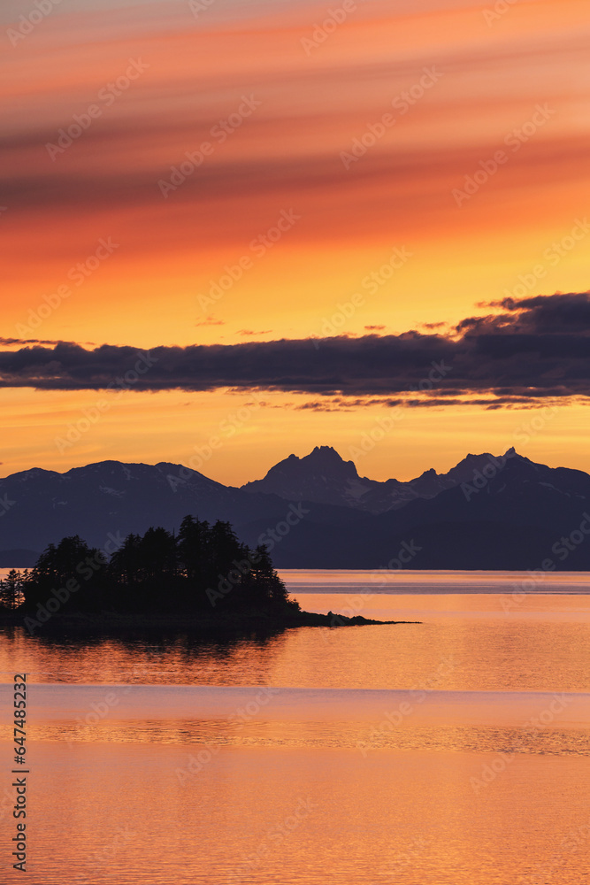 A Summer Sunset Colours The Sky Adjacent To Lynn Canal, With Chilkat Mountains In The Distance; Alaska, United States Of America A Summer Sunset Colours The Sky Adjacent To Lynn Canal, With Chilkat Mountains In The Distance; Alaska, United States Of America