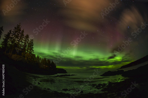 Northern Lights Reflecting In Ocean At Mill Bay Beach, Kodiak, Alaska
