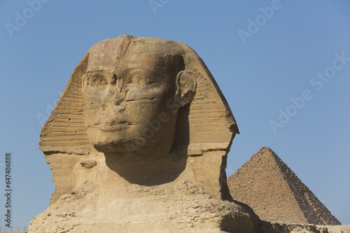 Sphinx (Foreground), Pyramid Of Mycerinus (Background), The Giza Pyramids; Giza, Egypt photo