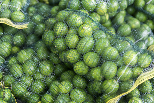 Net Bags Full Of Limes At The Tshwane Fresh Produce Market; Pretoria, Gautang, South Africa photo