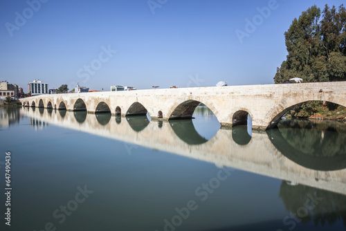 Ancient Roman Bridge Reflected In The Tranquil Water Of The Seyhan River; Adana, Turkey