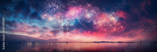 Spectacular Fireworks Display Lighting up the Night Sky over Water and City Skyline