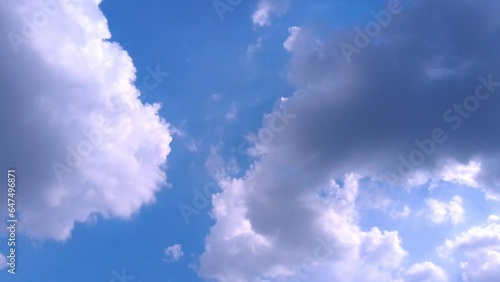 Light clouds move in the sky. Beautiful blue sky The cloud layers in the blue sky move horizontally in opposite directions. Time lapse