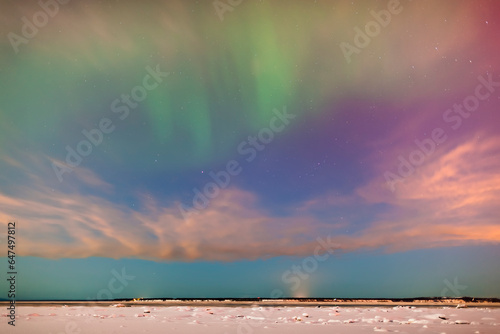 The northern lights in the night sky above knik arm from the tony knowles coastal trail in winter; Anchorage alaska united states of america photo