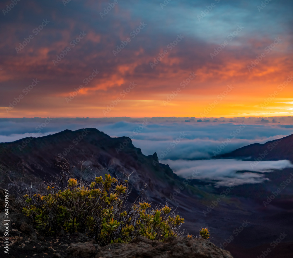 Sunrise above the clouds from Haleakala crater on the island of Maui, Hawaii, USA; Haleakala, Maui, Hawaii, United States of America Sunrise above the clouds from Haleakala crater on the island of Maui, Hawaii, USA; Haleakala, Maui, Hawaii, United States of America