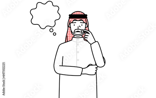 顔をかきながら考えるイスラムのシニア男性