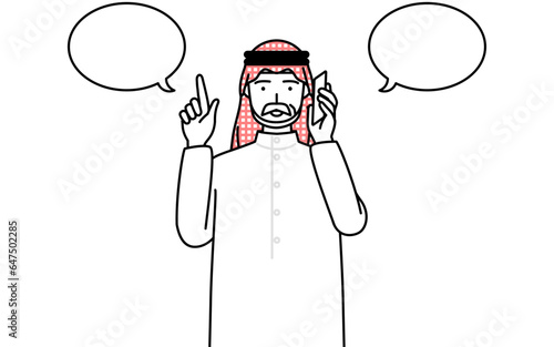電話をしながら指さしをするイスラムのシニア男性