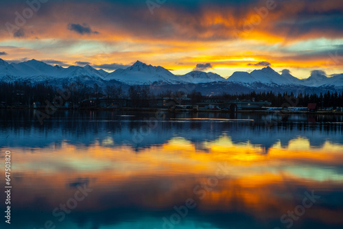 Dramatic sunrise over Lake Spenard and the Chugach Mountains in Alaska, USA