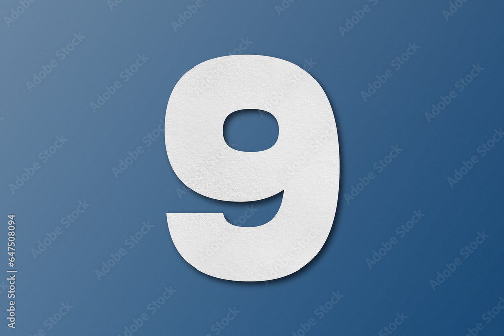 White paper font number 9 isolated on blue background. White paper font number 9 isolated on blue background.