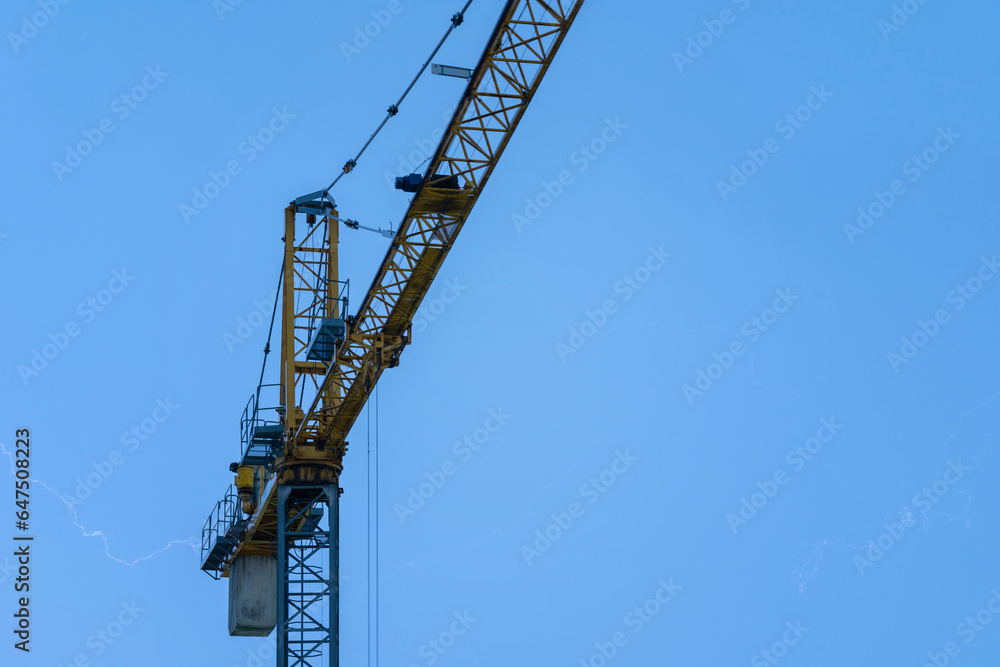 Crane and lightning, powerful thunderbolt. Weather risk assessments for the construction industry and built environment Crane and lightning, powerful thunderbolt. Weather risk assessments for the construction industry and built environment