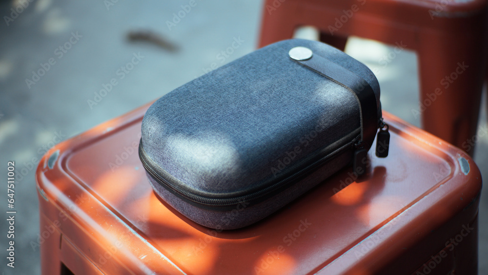 Close-up view of a mini travel pouch to accommodate electronic equipment. Can be used as a mockup. Close-up view of a mini travel pouch to accommodate electronic equipment. Can be used as a mockup.