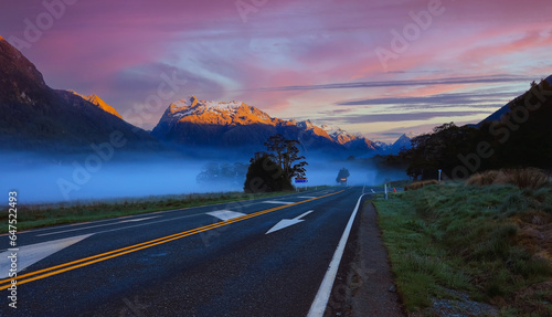 The Road trip view of travel with mountain view of autumn scene and foggy in the morning with sunrise sky scene at fiordland national park