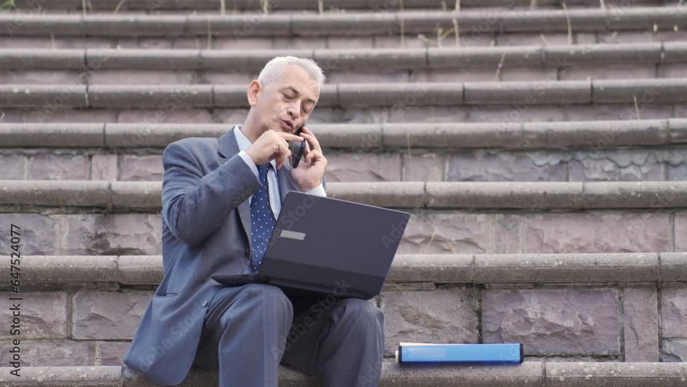 Businessman talking to his friend on the phone about business. Businessman talking to his friend on the phone about business.