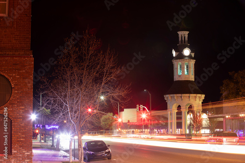 Фототапет Night time traffic streams through historic downtown Red Bluff, California, USA