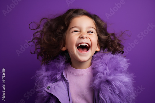 Studio portrait of cuttle little laughing girl on different colours background