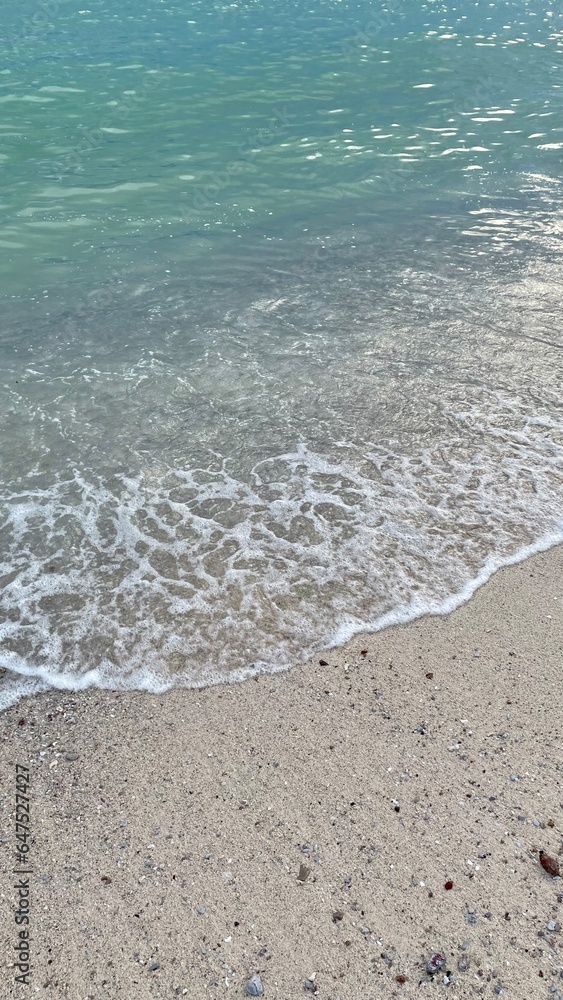 Soft wave of blue ocean on sandy beach. Background. Soft wave of blue ocean on sandy beach. Background.