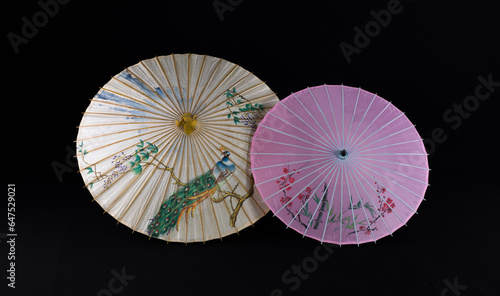 chinese paper umbrella on black background