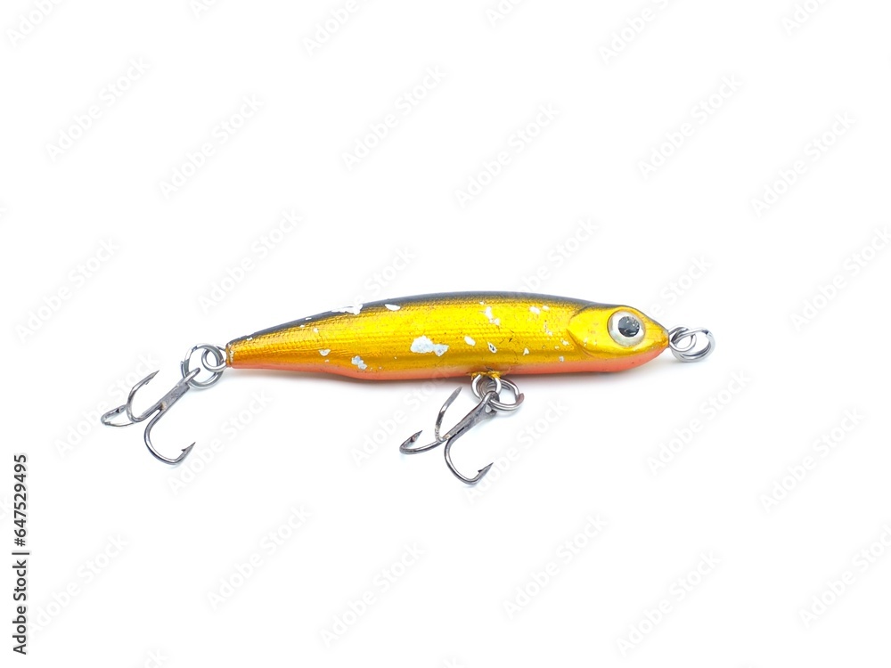 Picture of colorful fish shaped plug baits with 3 way hooks. Fishing equipment isolated on white background. Picture of colorful fish shaped plug baits with 3 way hooks. Fishing equipment isolated on white background.