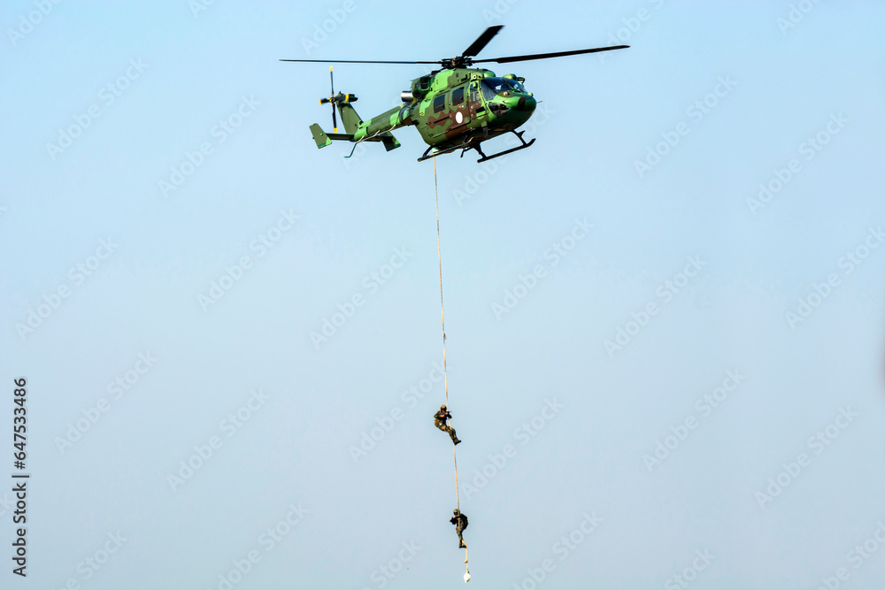 Para commando Slithering and Rappelling from helicopter. Air force demonstrate their capability in front of public