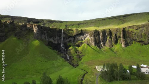 Beautiful waterfall spotted in the back yard, south part of Iceland. photo