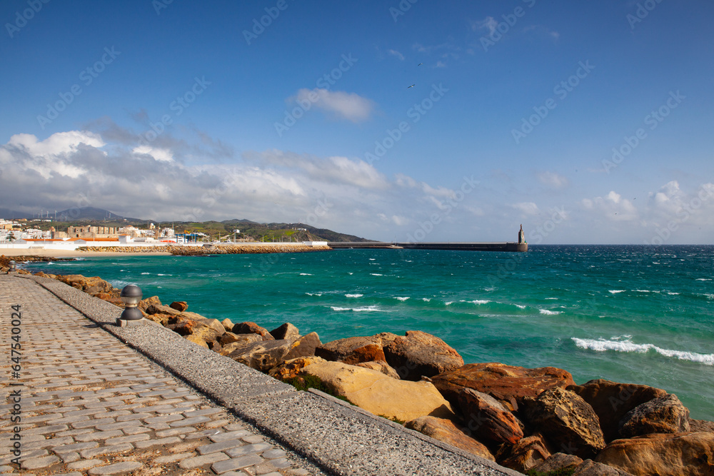 Fototapeta premium Old harbor and lighthouse in Tarifa, Andalusia, Spain.