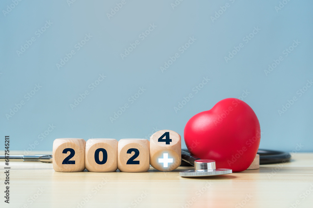 Happy New Year 2024 for health care and medical concept.Wooden block with 2024 number and medical sign.Red heart and stethoscope. - obrazy, fototapety, plakaty 