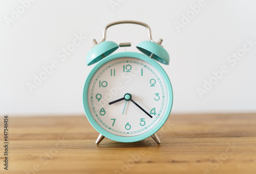 Alarm clock on the table background. Morning time and beginning of the day, timing, deadline concept
