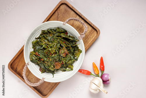 Tumis Pakis or Oseng Pakis is Stir Fry Fern Leaves. photo