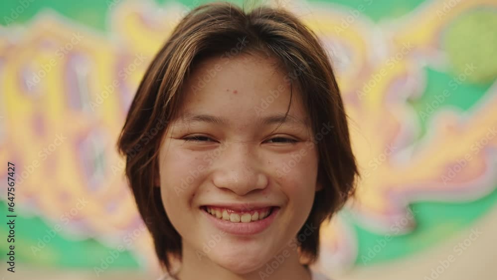 Vidéo Stock Portrait of Young Asian Girl Looking at Camera Close Up