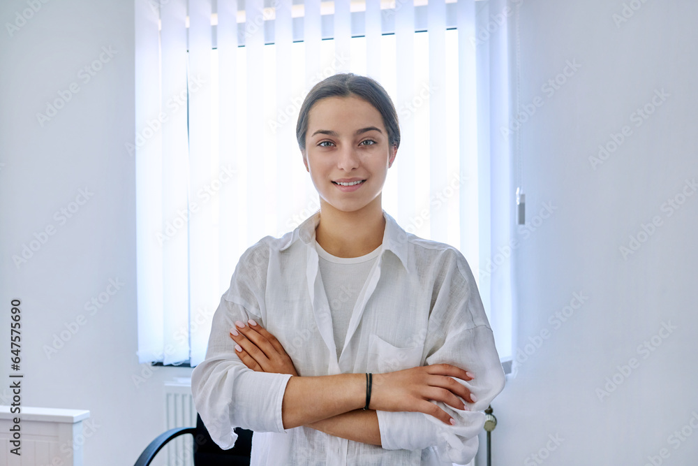 Portrait of smiling teen girl at home near window Portrait of smiling teen girl at home near window