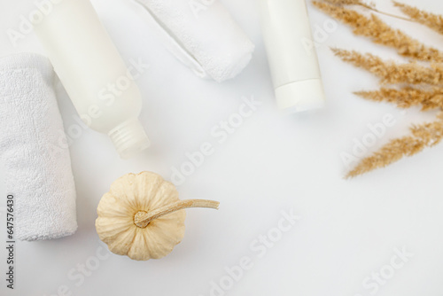 Hair and body care. Packaging for cosmetics and autumn d cor on a white background. Beauty product design, skincare and haircare concept.