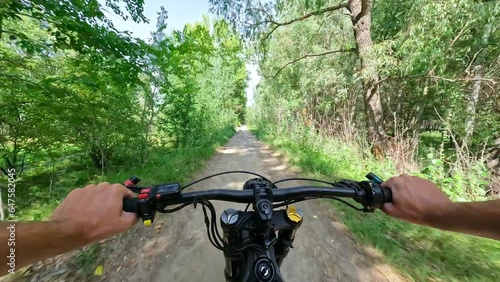 POV Electric Bike Riding on a Forest Road on the Elevation at Sunny Day. 60 fps, H.264, 8bit, chroma subsamlping 4:4:4