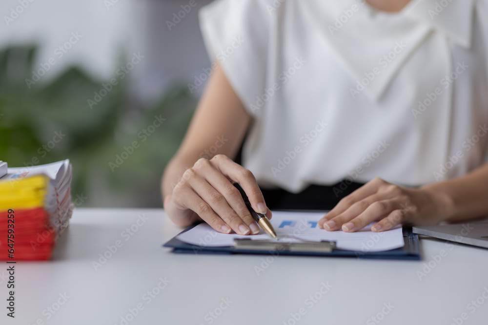 Businessman working at office with documents on his desk, doing planning analyzing the financial report, business plan investment, finance analysis concept Businessman working at office with documents on his desk, doing planning analyzing the financial report, business plan investment, finance analysis concept