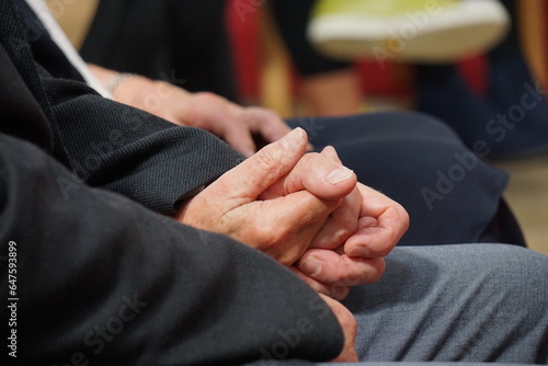 Old couple in love holding hands