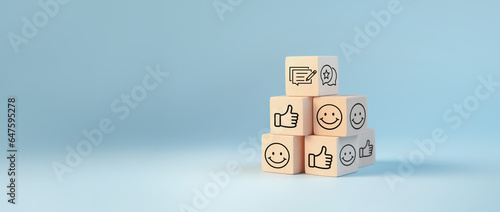 Positive feedback concept, Product ratings and customer service, Satisfaction review star ratings and evaluations, Wooden cube and customer feedback icon on pastel blue background photo