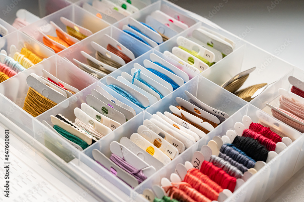 Convenient storage of floss for needlework. Plastic box. View from above Convenient storage of floss for needlework. Plastic box. View from above