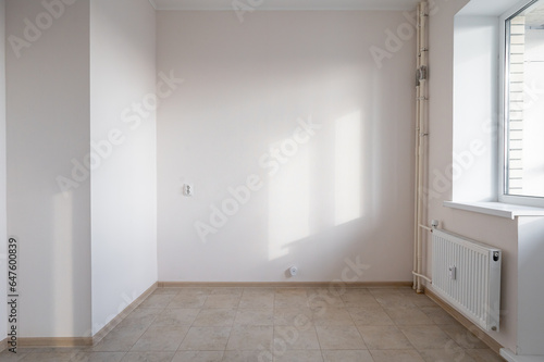 Fototapeta Naklejka Na Ścianę i Meble -  Photo of the interior, the apartment after a new renovation without furniture in style. A small studio apartment. Photo of the kitchen area.