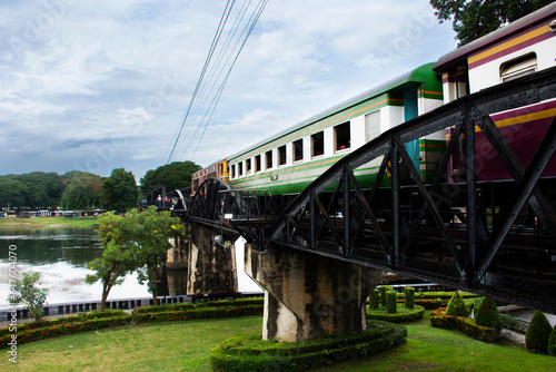 Steel railway bridge over river kwai of landmarks memorials historical sites and monuments World War II Sites for thai people foreign travelers travel visit and train running in Kanchanaburi, Thailand